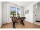 Spacious game room with hardwood floors, bright window, and foosball table at 4697 Golden Beach Ct, Kissimmee, FL 34746