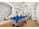 Entertainment room with a blue pool table and adjacent bar area at 4697 Golden Beach Ct, Kissimmee, FL 34746
