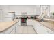 Bright and airy kitchen with white cabinets, stainless steel appliances, and tile flooring at 4697 Golden Beach Ct, Kissimmee, FL 34746