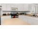 Well-lit kitchen boasts an island and plenty of cabinet and counter space at 4697 Golden Beach Ct, Kissimmee, FL 34746