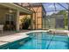 Beautiful pool area with an inground pool, spa, and large covered patio at 4697 Golden Beach Ct, Kissimmee, FL 34746