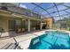 Relaxing screened-in pool and patio area, perfect for outdoor entertaining and leisure at 4697 Golden Beach Ct, Kissimmee, FL 34746