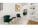Cozy sitting area with stylish green chairs and elegant decor at 4697 Golden Beach Ct, Kissimmee, FL 34746