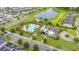 Aerial view of a community pool with lounge area, park, and lush landscaping at 4952 Creekside Park Ave, Orlando, FL 32811