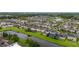 A waterfront home in a lush neighborhood with mature trees and a beautiful community layout at 4952 Creekside Park Ave, Orlando, FL 32811