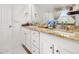 Bathroom featuring double sinks with granite countertops and decor at 4952 Creekside Park Ave, Orlando, FL 32811