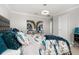 Bedroom with blue accents, and unique decor at 4952 Creekside Park Ave, Orlando, FL 32811