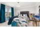 Bedroom with blue curtains, unique bedspread, and mirrored accents at 4952 Creekside Park Ave, Orlando, FL 32811