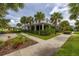 A clubhouse surrounded by well-maintained landscaping and green lawn, perfect for community gatherings at 4952 Creekside Park Ave, Orlando, FL 32811