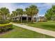 Beautiful clubhouse with green lawn and landscaping, perfect for community gatherings and events at 4952 Creekside Park Ave, Orlando, FL 32811