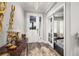 Elegant foyer boasts a beautiful front door and stylish decor leading into the home at 4952 Creekside Park Ave, Orlando, FL 32811