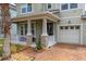 Inviting front porch with stone columns and a brick-paved path leading to the front door at 4952 Creekside Park Ave, Orlando, FL 32811