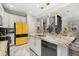 Bright kitchen featuring granite countertops, modern appliances, and stylish fixtures at 4952 Creekside Park Ave, Orlando, FL 32811