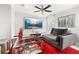 Stylish living room with a large TV, cozy couch, and elegant decor perfect for entertaining at 4952 Creekside Park Ave, Orlando, FL 32811