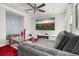 Comfortable living room featuring a large TV, cozy couch, and stylish decor for relaxation at 4952 Creekside Park Ave, Orlando, FL 32811