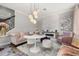 Inviting living space featuring a decorative fireplace, stylish furniture and modern lighting at 4952 Creekside Park Ave, Orlando, FL 32811
