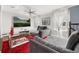 Inviting living room with a large TV, cozy couch, and chic decor perfect for relaxing and entertaining at 4952 Creekside Park Ave, Orlando, FL 32811