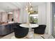 Modern living room showcasing a stylish dining table and bright natural light at 4952 Creekside Park Ave, Orlando, FL 32811