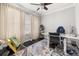 A modern office space featuring dark wood floors, neutral colors, and a large window at 4952 Creekside Park Ave, Orlando, FL 32811