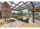 Granite countertop on the outdoor kitchen featuring a sink with a lake view beyond at 4952 Creekside Park Ave, Orlando, FL 32811