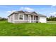 Charming one-story home featuring a lush green lawn and a neutral, modern color scheme at 515 Everest Way, Kissimmee, FL 34758