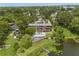 Modern home boasts an inground pool and lake access with a private dock at 550 Lake Otis Se Dr, Winter Haven, FL 33880