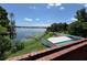 Backyard view highlighting the pool and scenic lake access, perfect for outdoor enjoyment at 550 Lake Otis Se Dr, Winter Haven, FL 33880