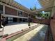 Backyard brick home featuring a patio, pool, and seating area at 550 Lake Otis Se Dr, Winter Haven, FL 33880