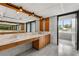 Bathroom featuring a marble countertop vanity, mirrors, and a separate shower at 550 Lake Otis Se Dr, Winter Haven, FL 33880