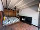 Bedroom featuring brick floor, ceiling fan, and paneled closet at 550 Lake Otis Se Dr, Winter Haven, FL 33880