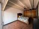 Bedroom featuring brick floor, ceiling fan, and paneled closet at 550 Lake Otis Se Dr, Winter Haven, FL 33880