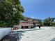 Contemporary home featuring a swimming pool and multiple balconies at 550 Lake Otis Se Dr, Winter Haven, FL 33880