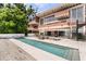 Contemporary home featuring a swimming pool and multiple balconies at 550 Lake Otis Se Dr, Winter Haven, FL 33880