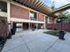 Home exterior featuring a brick facade and open patio area with lake views at 550 Lake Otis Se Dr, Winter Haven, FL 33880