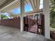 Brick home featuring a gated entrance with walkway to front door at 550 Lake Otis Se Dr, Winter Haven, FL 33880