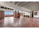 Elegant living room with fireplace, brick floors and stunning water view from multiple sliding glass doors at 550 Lake Otis Se Dr, Winter Haven, FL 33880