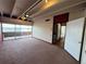 Spacious living area featuring ceiling fan and sliding glass doors to a brick patio with water views at 550 Lake Otis Se Dr, Winter Haven, FL 33880