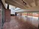 Open living area with brick accents, high ceilings, and sliding glass doors at 550 Lake Otis Se Dr, Winter Haven, FL 33880