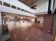 Modern living room with brick floors, tall ceilings, exposed beams, and a courtyard view at 550 Lake Otis Se Dr, Winter Haven, FL 33880
