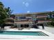 Striking multi-story home with an inviting pool and outdoor staircase at 550 Lake Otis Se Dr, Winter Haven, FL 33880