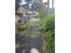 View of a backyard with weed control fabric and storage shed, ready for new landscaping at 655 Vine Ct, Apopka, FL 32703