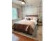 Comfortable bedroom featuring soft lighting, cozy bedding, and stylish decor for relaxation and restful sleep at 655 Vine Ct, Apopka, FL 32703