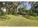 Spacious front yard with large trees that provides shade and curb appeal to this beautiful home at 655 Vine Ct, Apopka, FL 32703