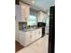 Modern kitchen featuring white cabinetry, granite countertops, stainless steel appliances, and tile backsplash at 655 Vine Ct, Apopka, FL 32703