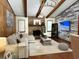 Bright and inviting living room featuring a cozy fireplace, stylish furnishings, and hardwood flooring at 655 Vine Ct, Apopka, FL 32703