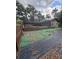View of a screened pool area and patio needing some cleaning and repair at 655 Vine Ct, Apopka, FL 32703