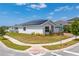 Corner lot home featuring solar panels, lush lawn and attractive landscaping at 6651 Syreeta Ln, Harmony, FL 34773