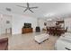 Expansive open-concept living area with tile flooring, dining area, and kitchen access at 6651 Syreeta Ln, Harmony, FL 34773