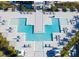 Aerial view of the community pool and the many places to relax and enjoy the sun at 7773 Spectrum Dr, Reunion, FL 34747