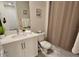 Well-lit bathroom with a single sink, white cabinets, and a shower-tub combination, offering a clean and functional space at 7773 Spectrum Dr, Reunion, FL 34747